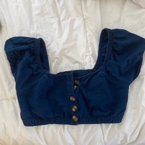 Buttons in the front. Can be worn as an off the shoulder top. American eagle